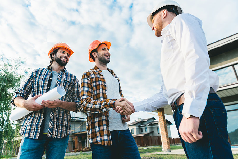 photo of architects working on an Alberta job site, thanks to the open work permit acquired for working in Canada with the help of Canadian Immigration Group